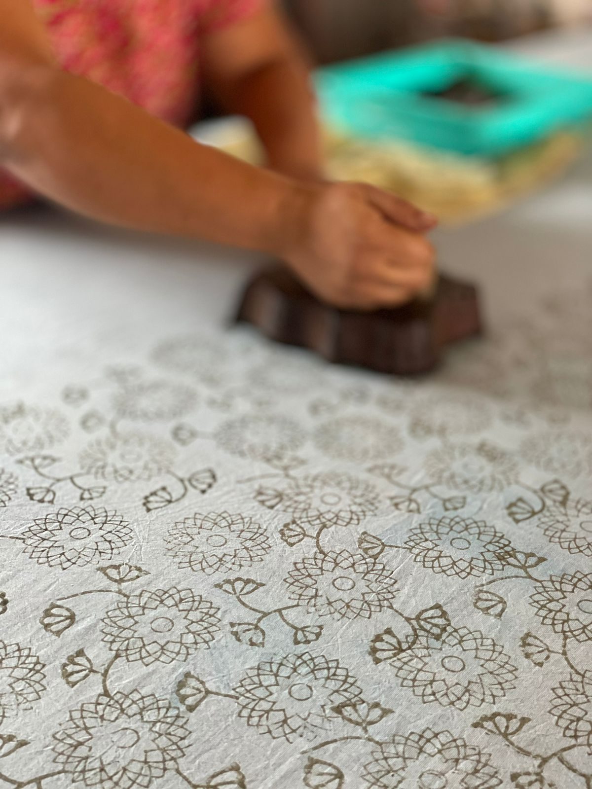 Block-printed fabric still life — indigo and natural cotton pieces arranged artfully