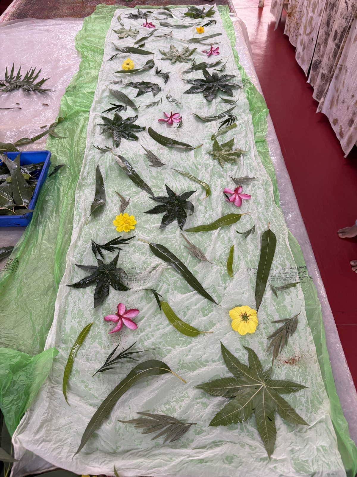 Delicate eco-print artwork — dried flowers pressed onto natural fabric